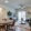 a large living room with a dining table and chairs